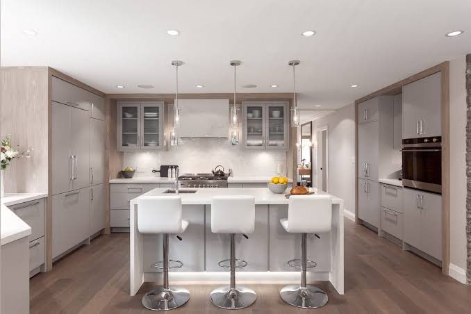 Modern kitchen renovation with quartz countertops and custom cabinets increasing home value in the GTA
