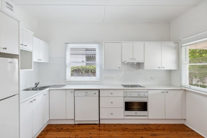 Homeowner meeting with a full-service kitchen contractor for a complete kitchen renovation project in the GTA